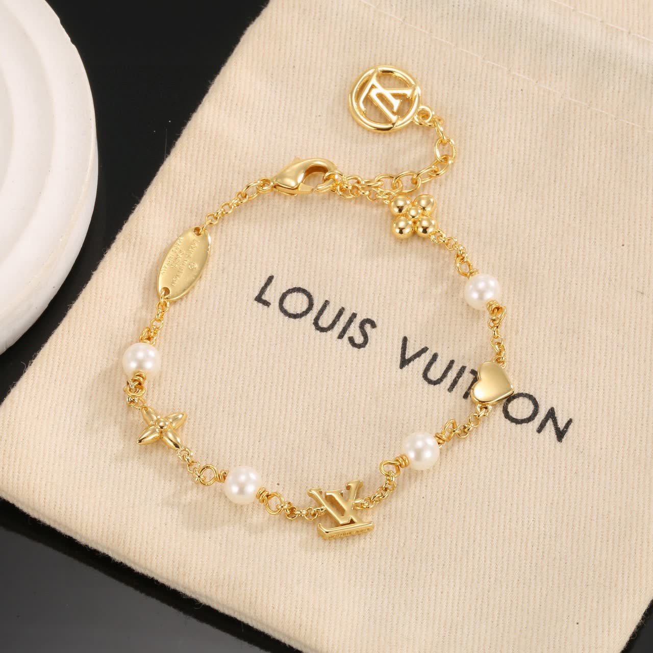 Louis Vuitton Gold Tone Bracelet with Pearls and Charms